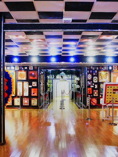 Butterfly exhibits and heart-shaped balloon display at Dubai Butterfly Garden.