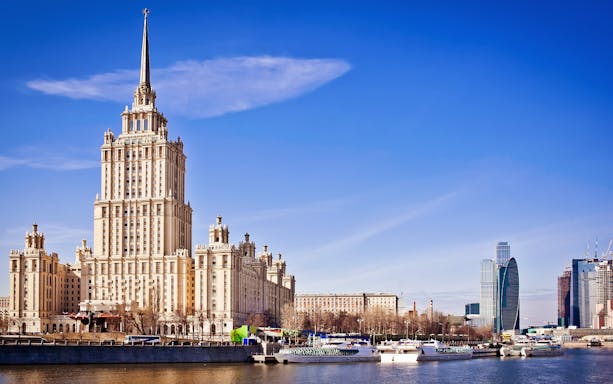 Kremlin tour view with Moscow River and historic building.