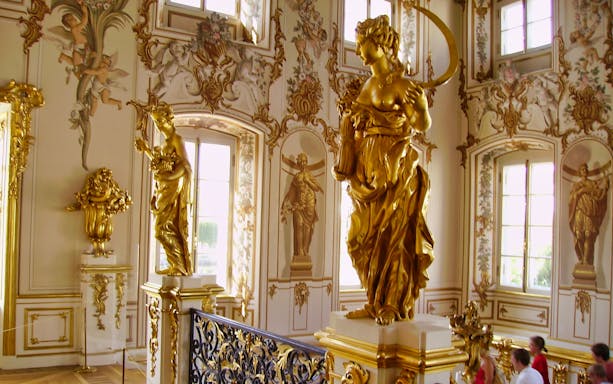 Golden statues and ornate decor inside the Hermitage Museum during a private tour.