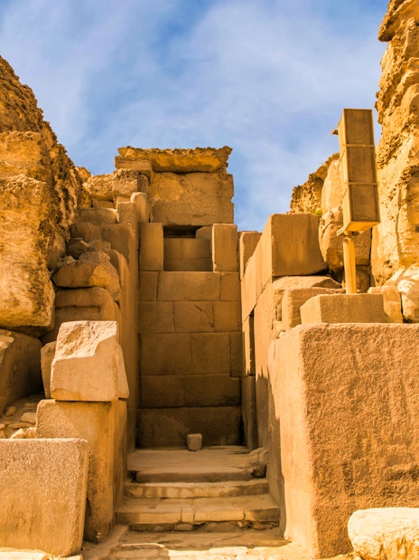 Ancient stone structure at the Pyramids, Egypt, part of a private quad and camel ride tour.