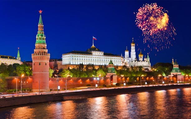 Kremlin and fireworks during Moscow City Walking Tour at night.