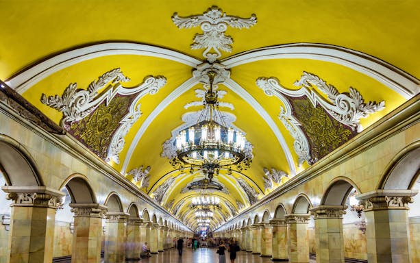 Moscow metro station with ornate chandeliers and decorative arches on the After Dark tour.