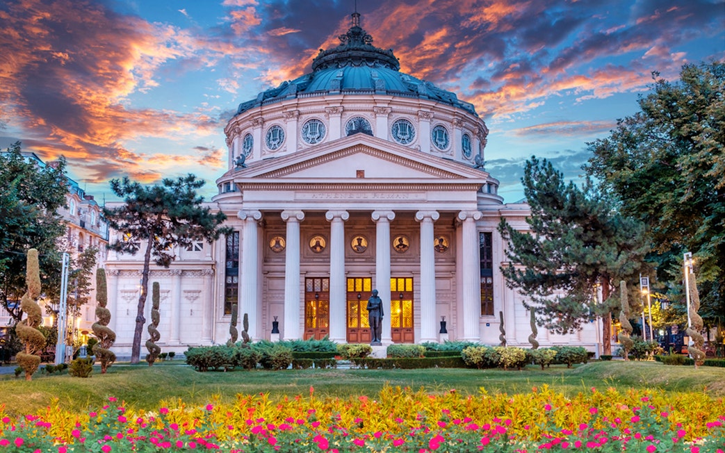 Romanian Athenaeum in Bucharest at sunset, part of private sightseeing tour.