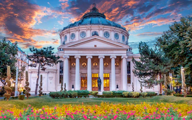 Romanian Athenaeum in Bucharest at sunset, part of private sightseeing tour.