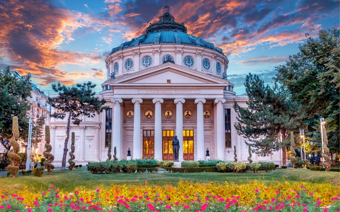 Romanian Athenaeum in Bucharest at sunset, part of private sightseeing tour.