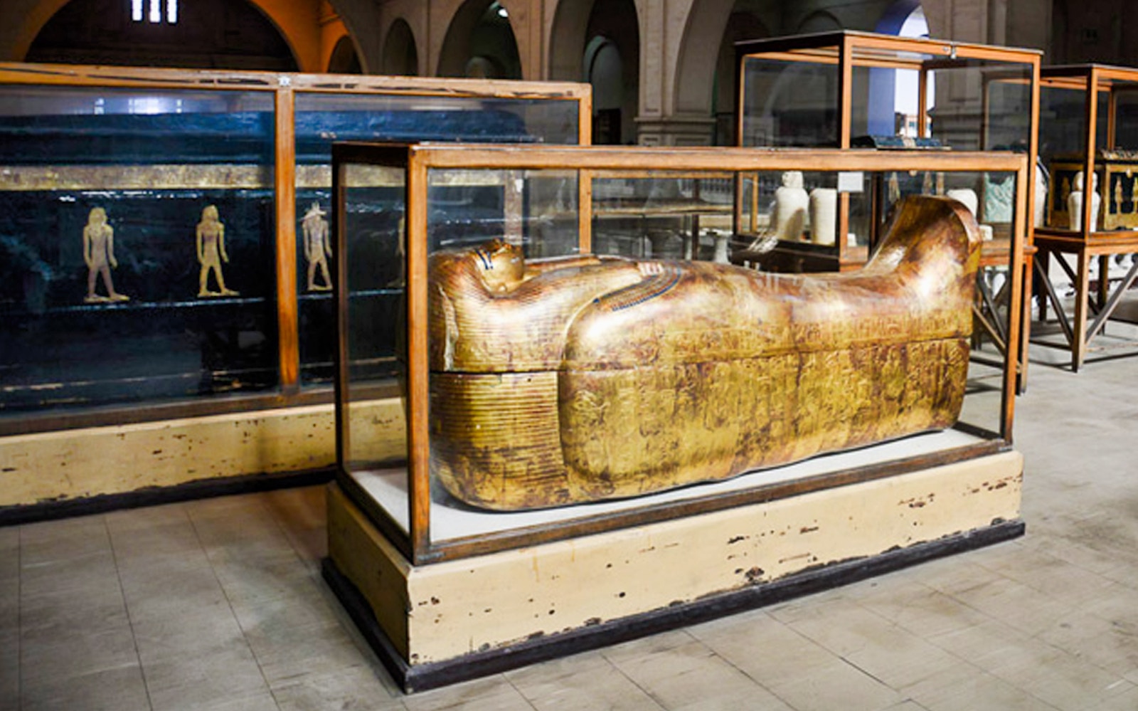 Golden sarcophagus display at the Egyptian Museum, Cairo, part of the Giza Pyramids and Egyptian Museum tour.