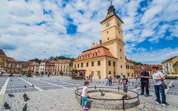 Brașov Council Square with Black Church in background, part of Dracula's life journey tour.