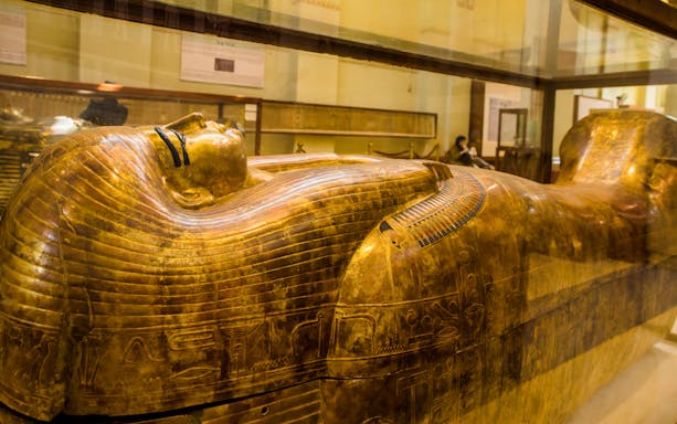 Golden sarcophagus on display at the Egyptian Museum during a skip-the-line guided tour.