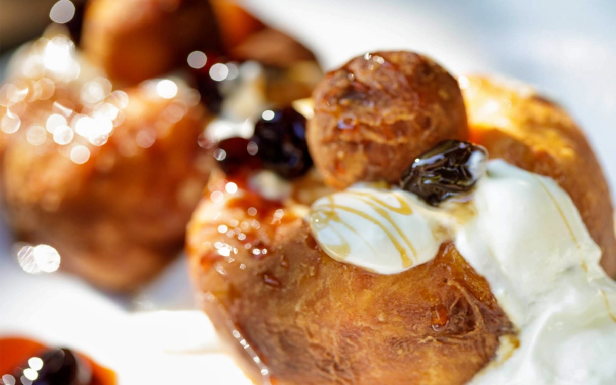 Traditional dessert with cream and syrup served on the After Dark City Tour.