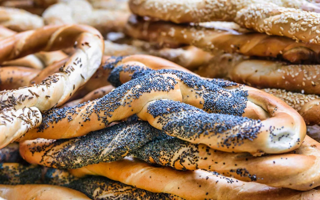 Poppy seed-covered pretzels on the Unhealthy Food Tour of Bucharest.