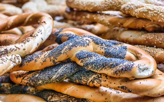 Poppy seed-covered pretzels on the Unhealthy Food Tour of Bucharest.
