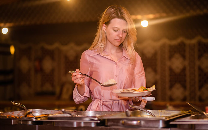 Buffet dinner during desert safari tour in Dubai.