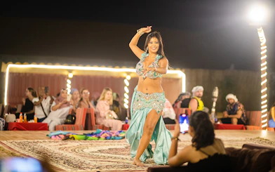 Belly dancer performing at a Dubai desert safari evening show.
