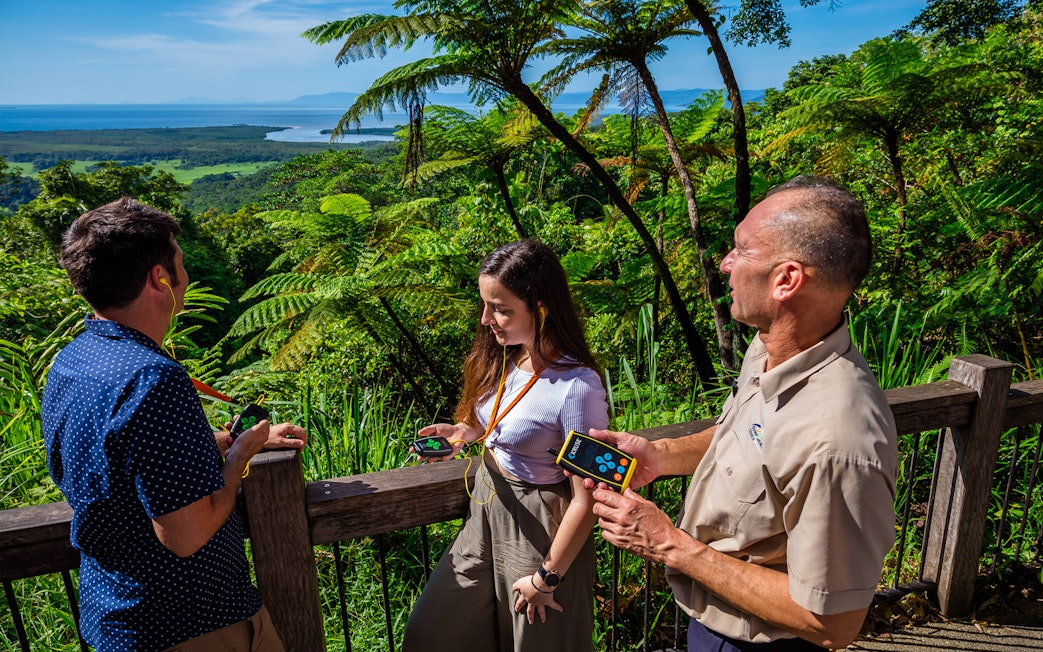 Tourists enjoying a guided tour at Cape Tribulation with views of Daintree Rainforest.