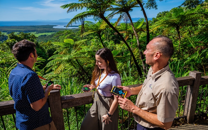 Tourists enjoying a guided tour at Cape Tribulation with views of Daintree Rainforest.