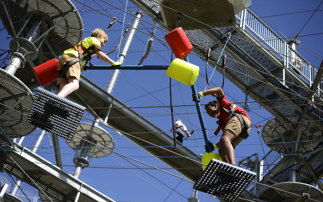 Children navigating a ropes course at West Beach Adventure.