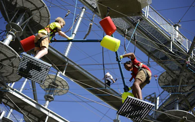 Children navigating a ropes course at West Beach Adventure.