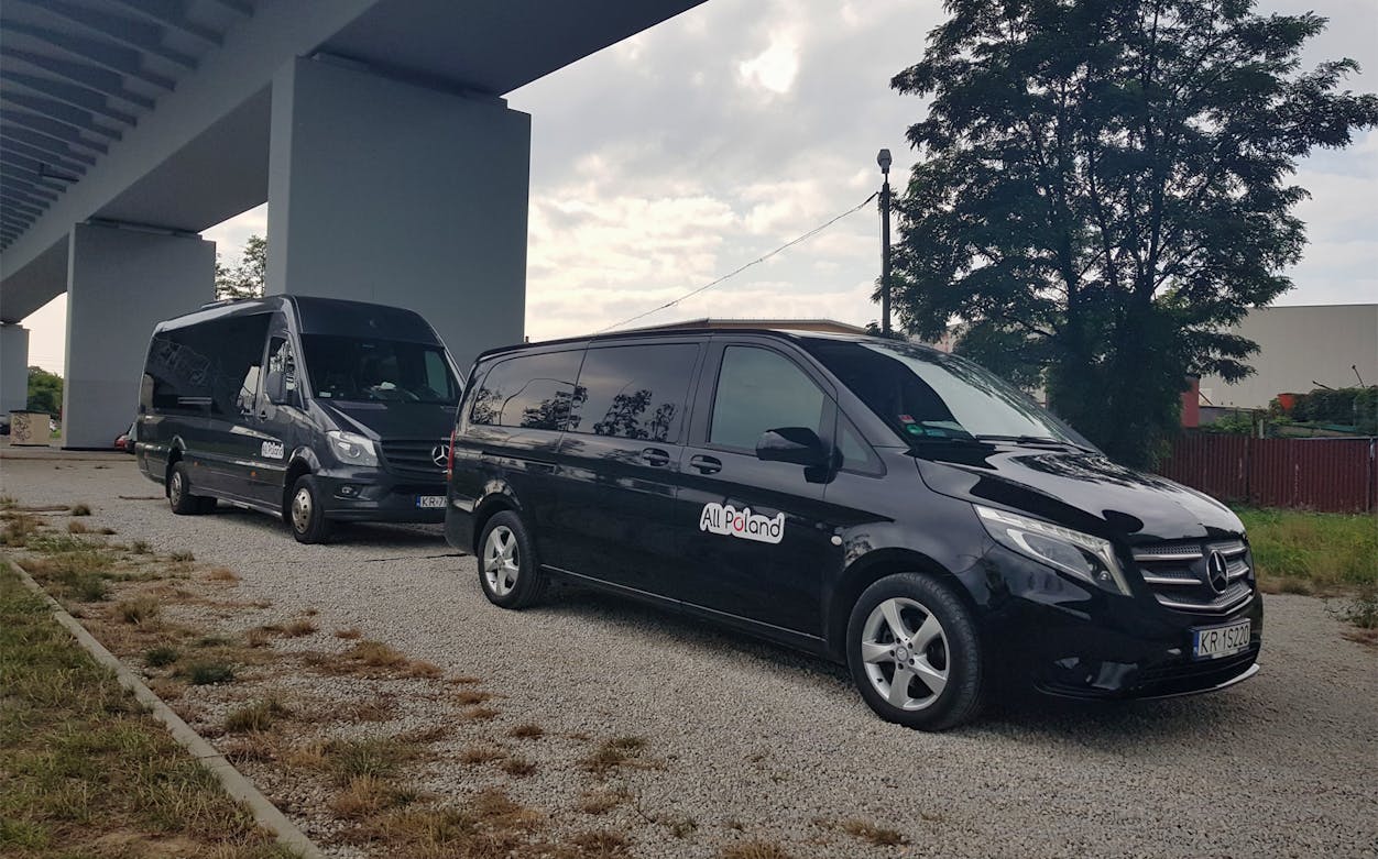 Private transfer vans for St Petersburg LED Airport under a bridge.