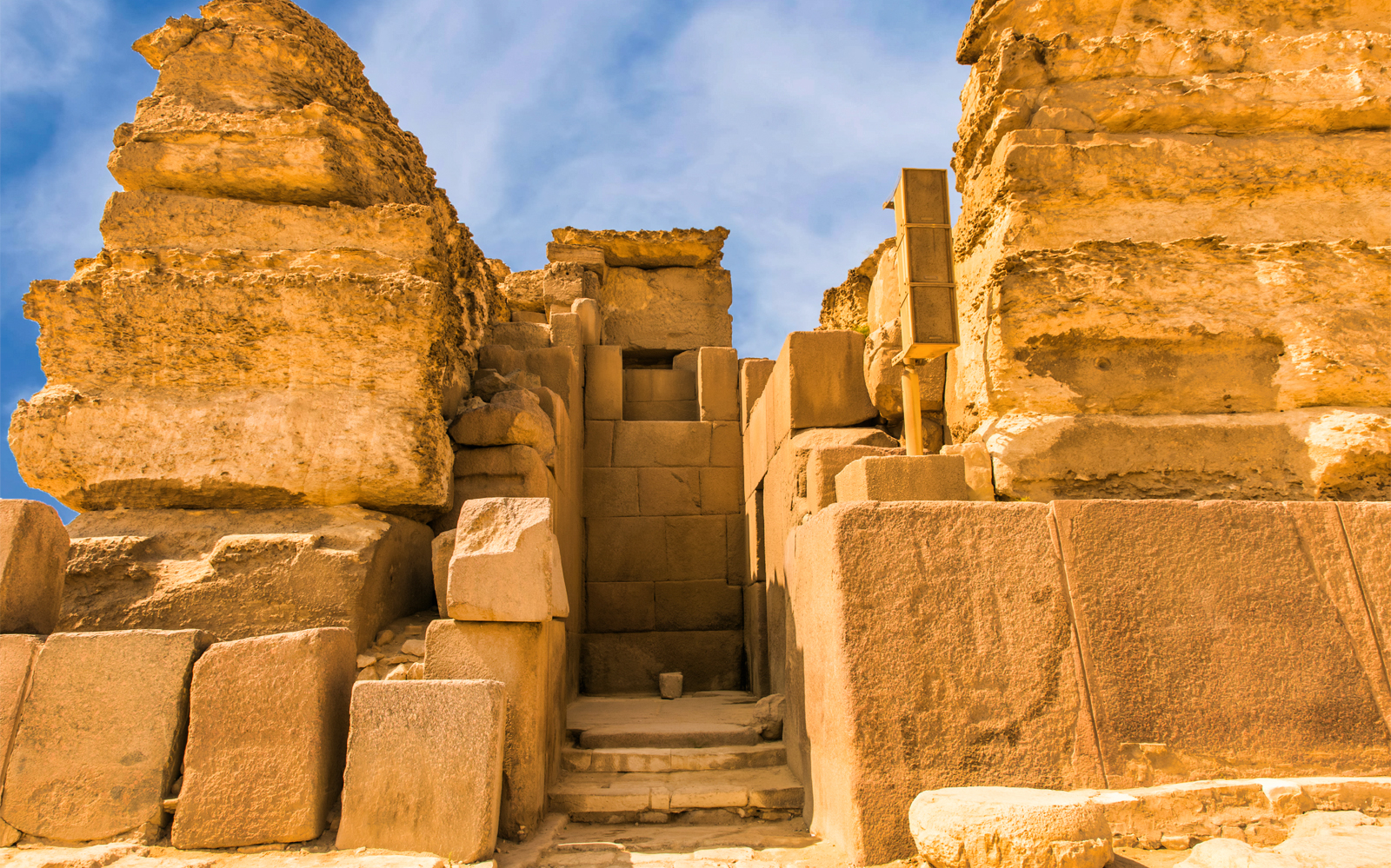 Ancient stone structure at the Giza Pyramids, part of a Cairo tour.