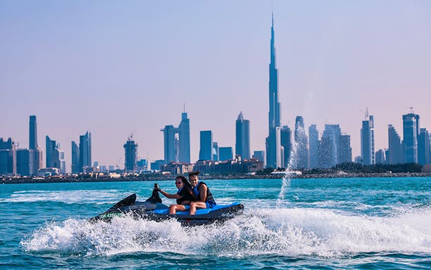 Jet ski ride on the Red Sea with city skyline in the background.