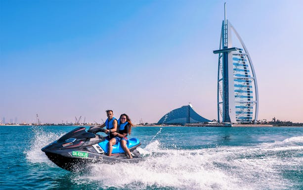 Jet ski ride near Burj Al Arab, Dubai, during Red Sea full-day trip from Cairo.