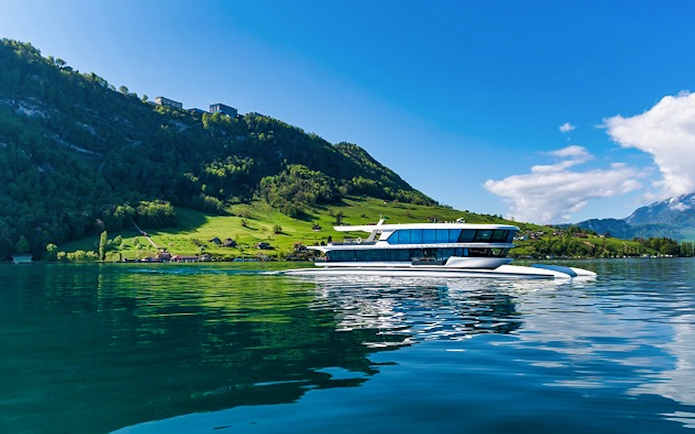 Boat cruising on Lake Lucerne with Mt. Bürgenstock in the background, Switzerland.
