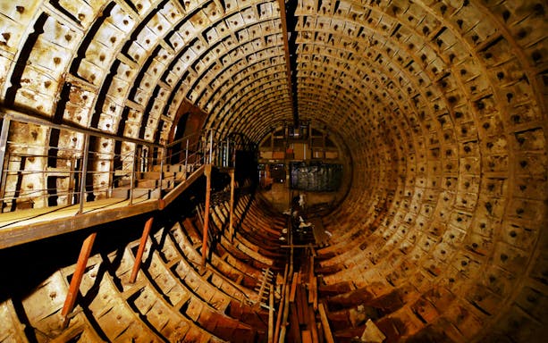 Bunker 42 tunnel interior with metal walkway, part of Cold War Museum tour.