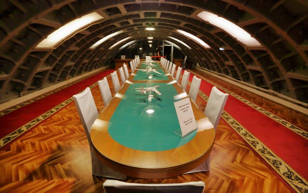 Meeting room inside Bunker 42 Cold War Museum with long table and chairs.