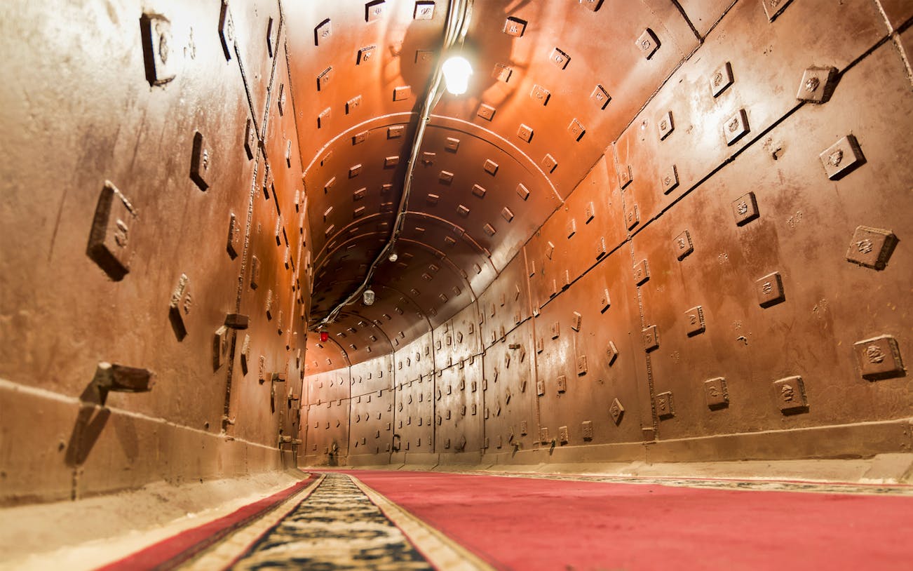 Bunker 42 corridor with red carpet, part of Cold War Museum guided tour.