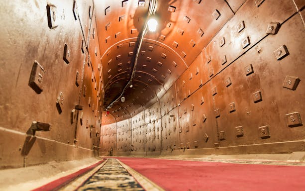 Bunker 42 corridor with red carpet, part of Cold War Museum guided tour.