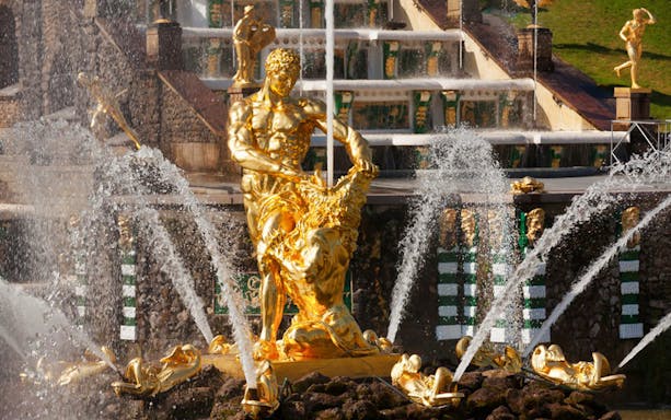 Golden Samson Fountain at Peterhof Grand Palace, Russia, with water jets and sculptures.