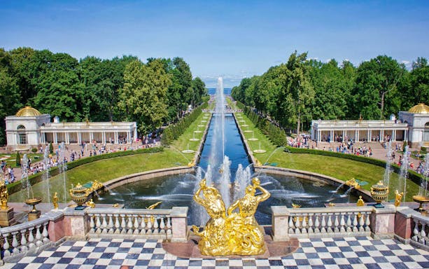 Peterhof Grand Palace gardens with fountains and golden statues, St. Petersburg, Russia.
