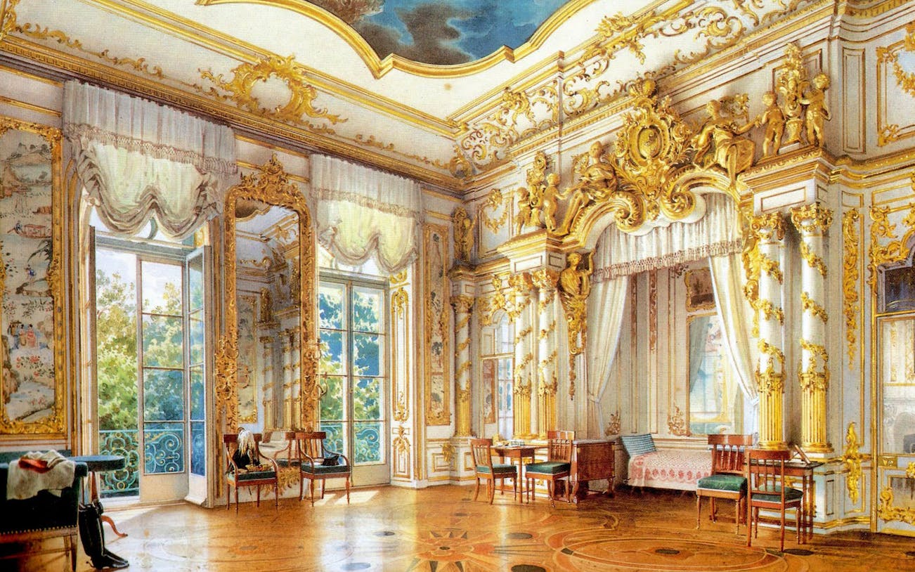 Peterhof Grand Palace interior with ornate gold decorations and large windows.