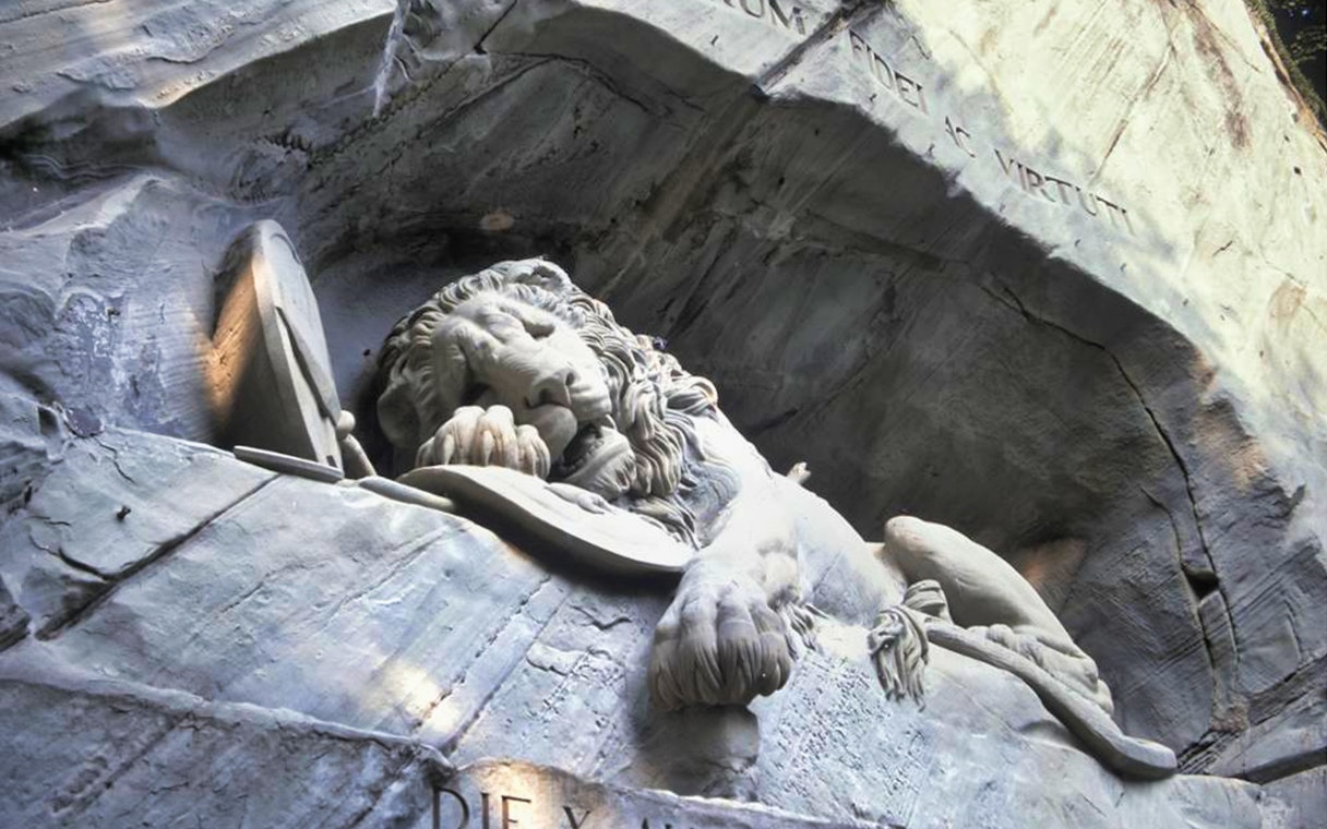 Lion Monument in Lucerne, Switzerland, depicting a dying lion carved into rock.