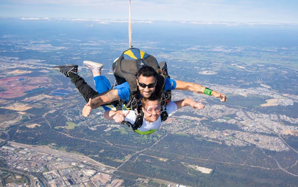 Tandem skydive over Rockingham, Perth from 15,000ft with cityscape below.