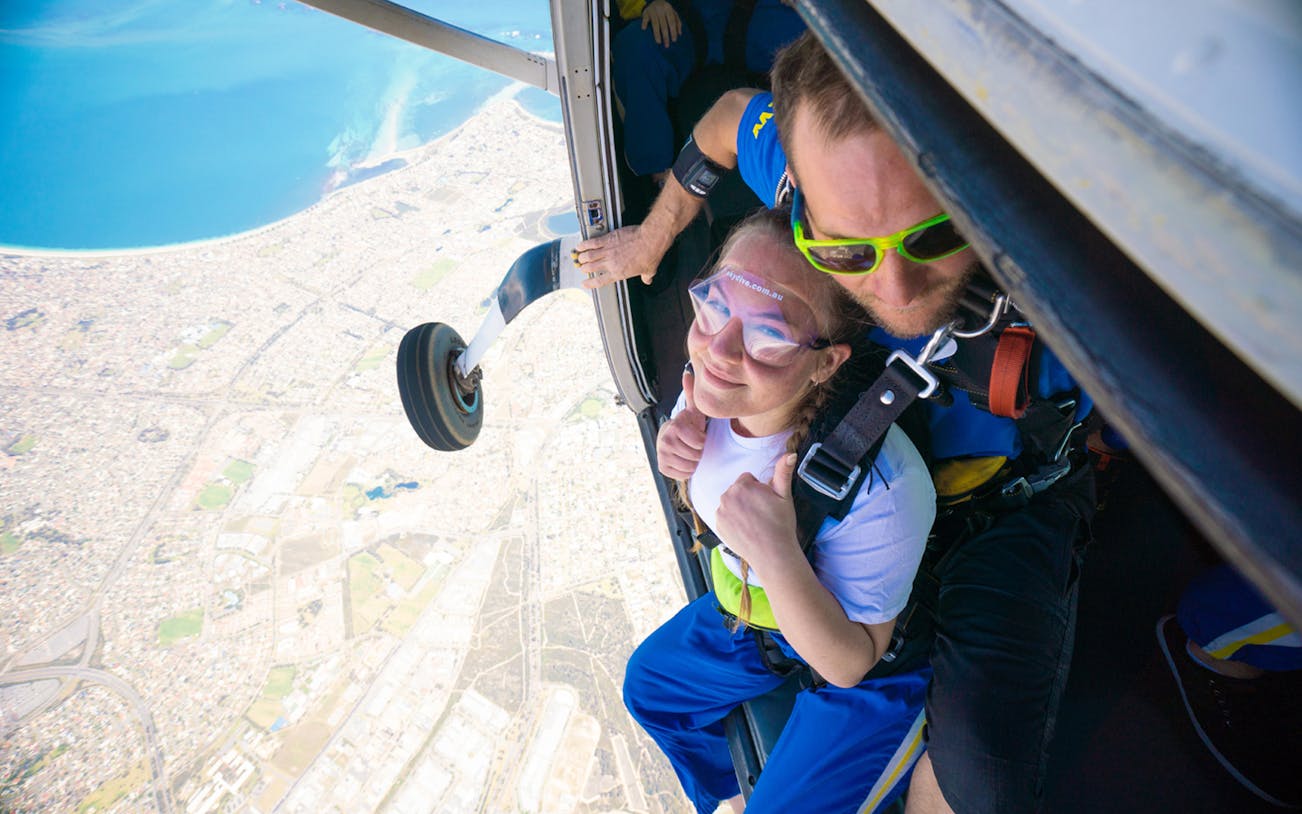 Tandem skydive over Perth from 15,000ft with view of coastline and city below.