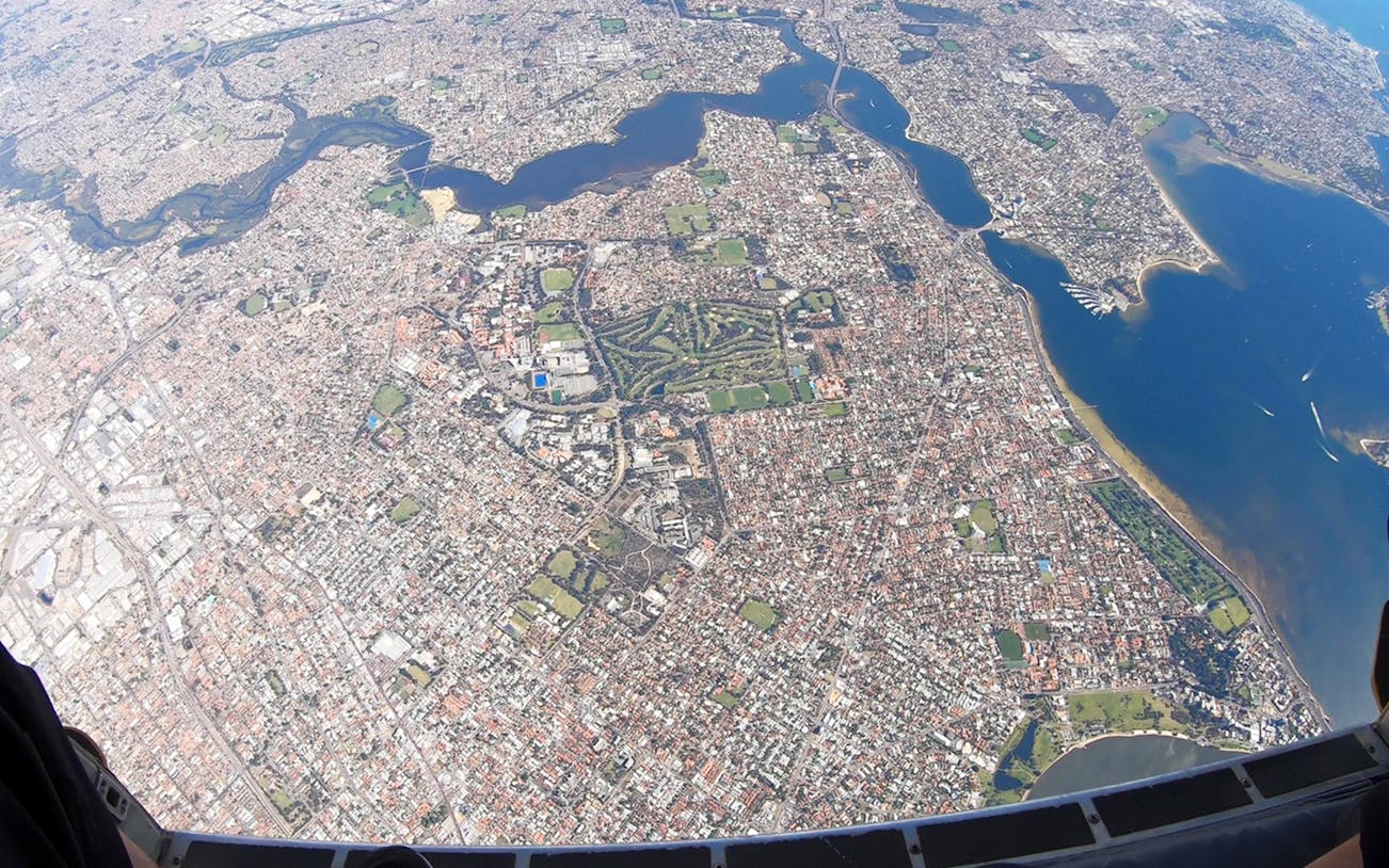 Aerial view of Perth cityscape and coastline from 14,000ft during tandem skydive.