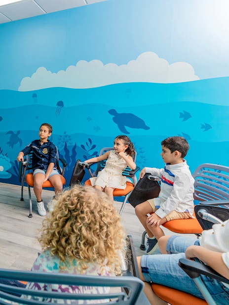 Children learning about marine life at National Aquarium Abu Dhabi.