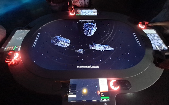 Interactive space-themed exhibit at Museum of the Future, Dubai, with digital controls and spacecraft visuals.