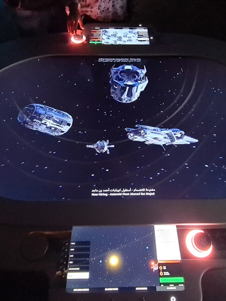 Interactive space-themed exhibit at Museum of the Future, Dubai, with digital controls and spacecraft visuals.
