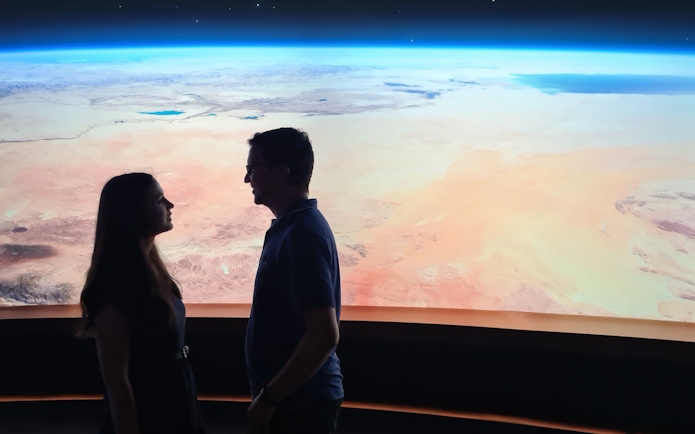 Visitors viewing Earth exhibit at Dubai Museum of the Future.