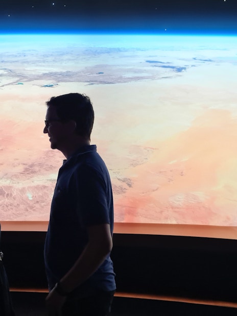 Visitors viewing Earth exhibit at Dubai Museum of the Future.