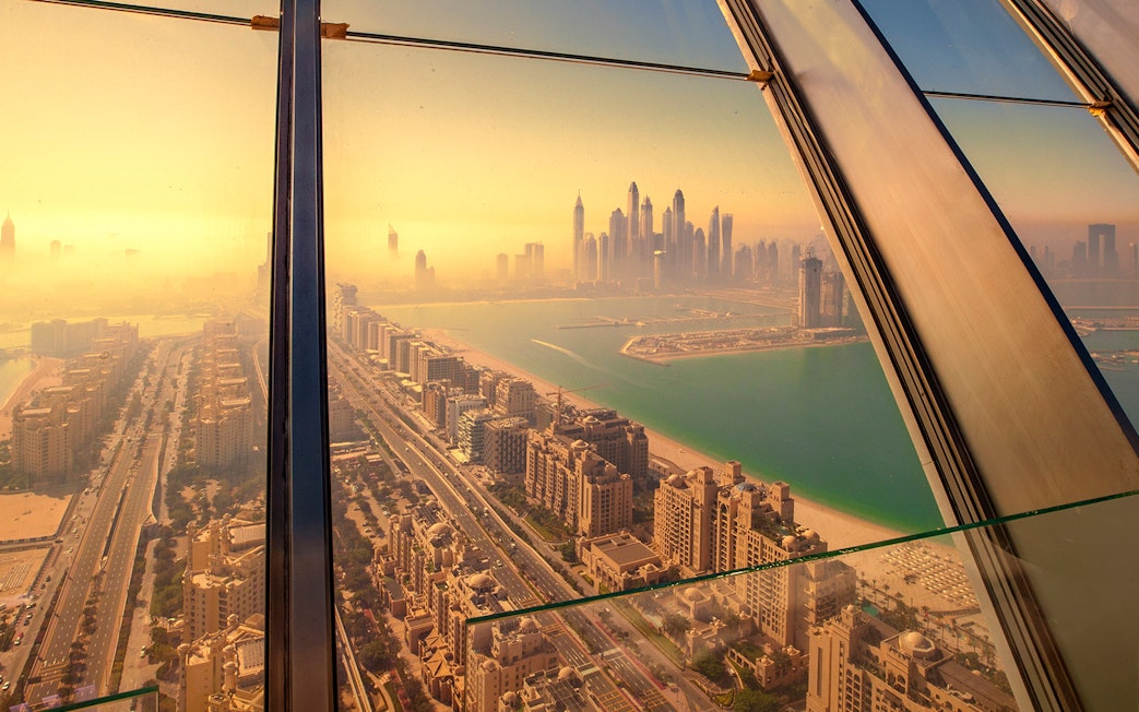 View of Dubai skyline and Palm Jumeirah from The View at The Palm observation deck.