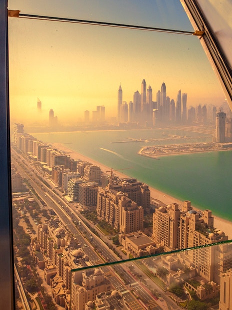 View of Dubai skyline and Palm Jumeirah from The View at The Palm observation deck.