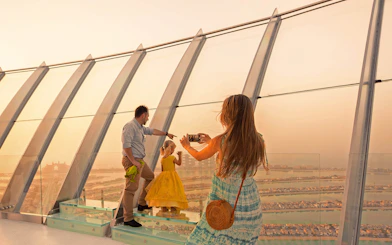 Family enjoying panoramic view from The View at The Palm, Dubai.