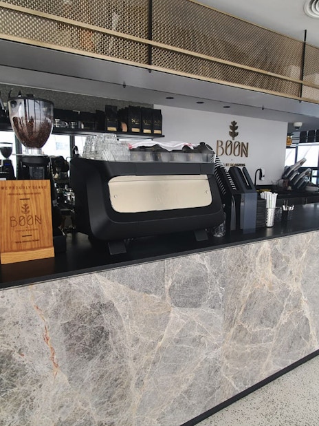 Coffee bar inside Dubai Frame with staff preparing beverages.
