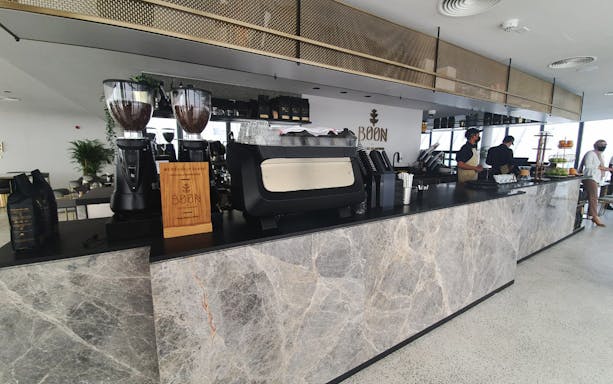 Coffee bar inside Dubai Frame with staff preparing beverages.