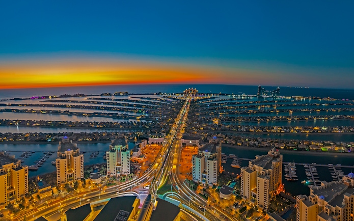 Aerial view of Palm Jumeirah at sunset, Dubai, highlighting The View At The Palm.