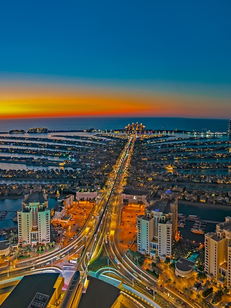 Aerial view of Palm Jumeirah at sunset, Dubai, highlighting The View At The Palm.