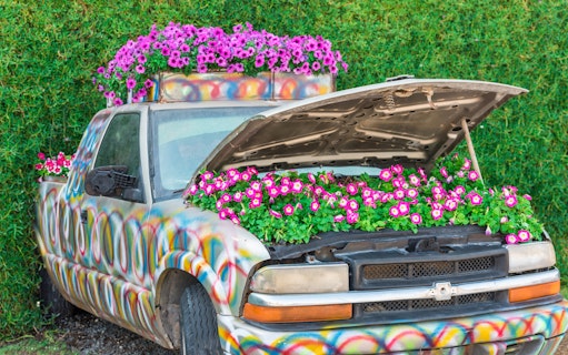 Colorful truck with flowers in the hood at Dubai Miracle Garden.